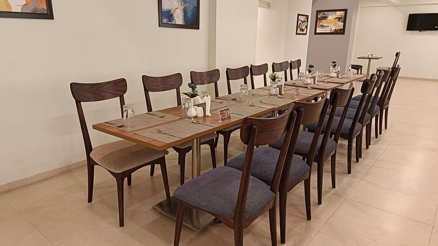 Seating arrangement inside the restaurant 1 - Starlit Suites, Shirdi