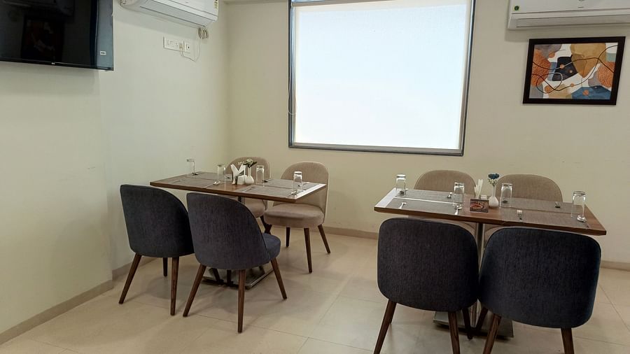 Seating arrangement inside the restaurant 2 - Starlit Suites, Shirdi