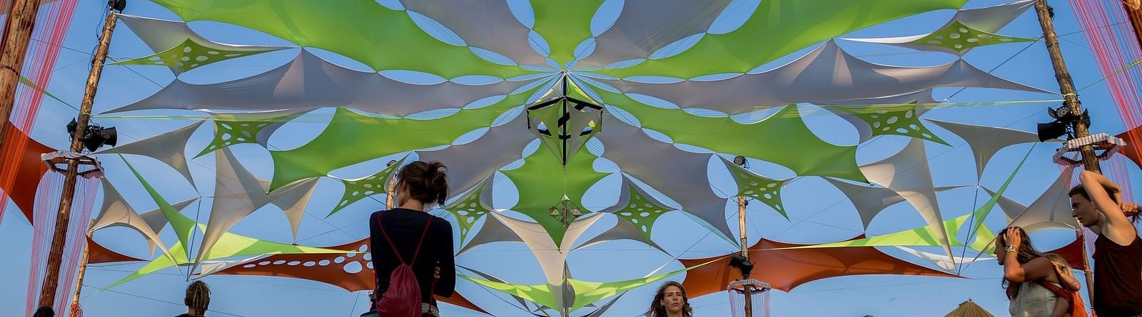 Image of a group of people with fancy decor above them.