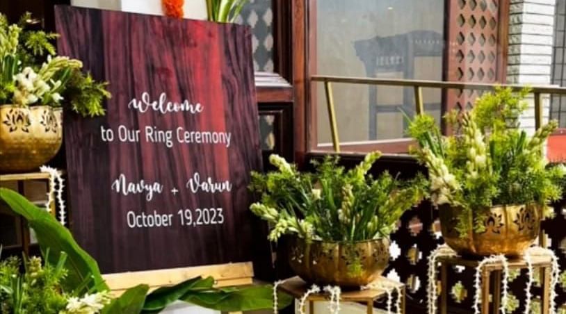 image of a wedding invitation creative outside the tambulam at hoysala village resort in hassan