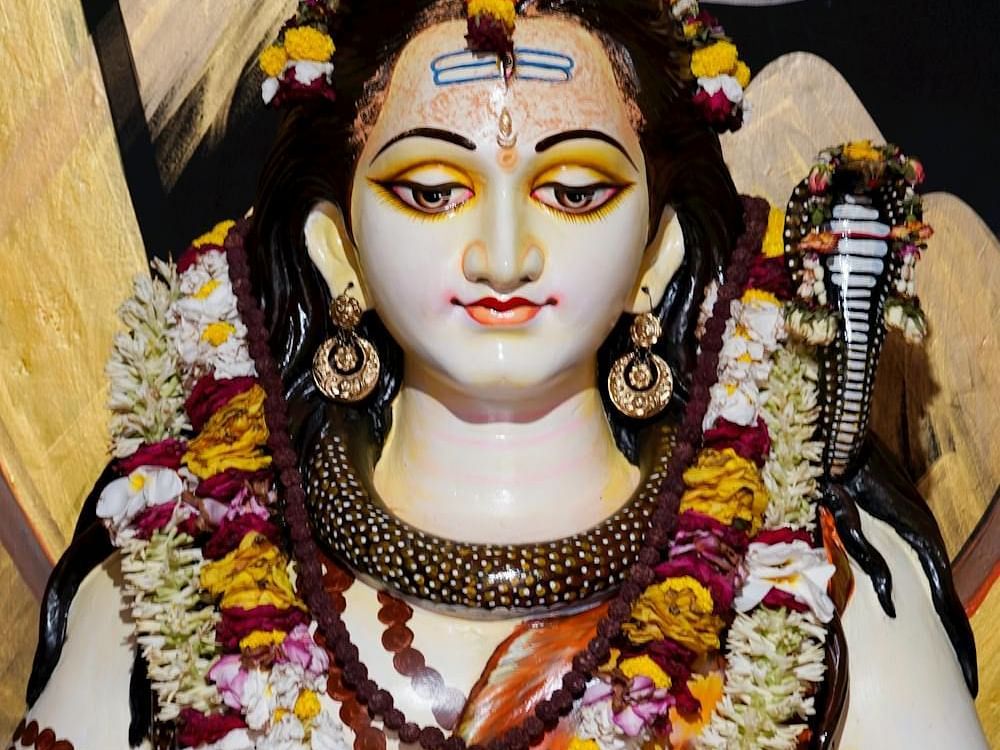 Images of Shiva with garlands around his neck