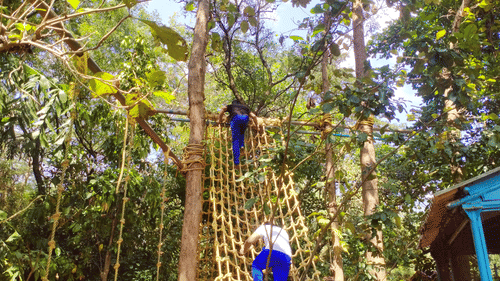 Two people trying their hand at Cargo Net - Black Thunder, Coimbatore