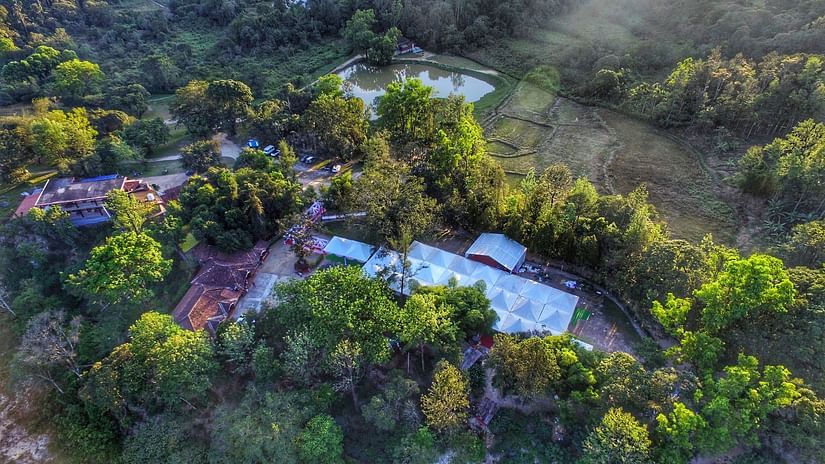 Aerial view of Capitol Village Resort, Madikeri with tree surrounding it