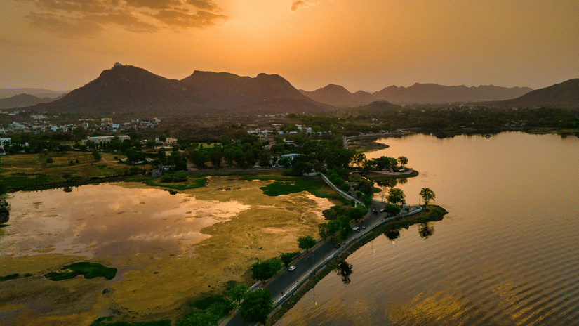 An aerial view of the Fateh Sagar Lake during sunset.