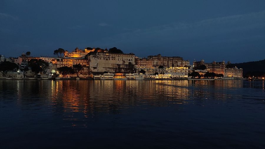 night view of an old and royal fort in Jaipur amidst a lake