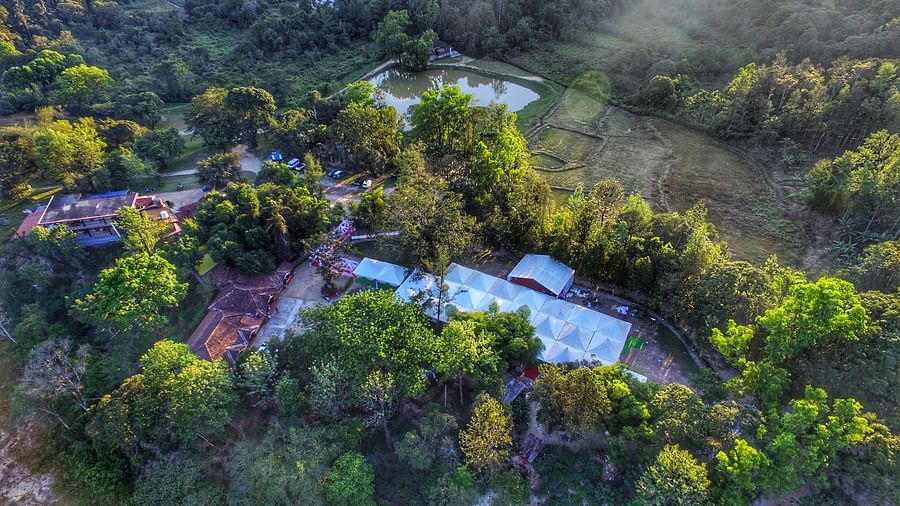 Aerial view of Capitol Village Resort, Madikeri with tree surrounding it