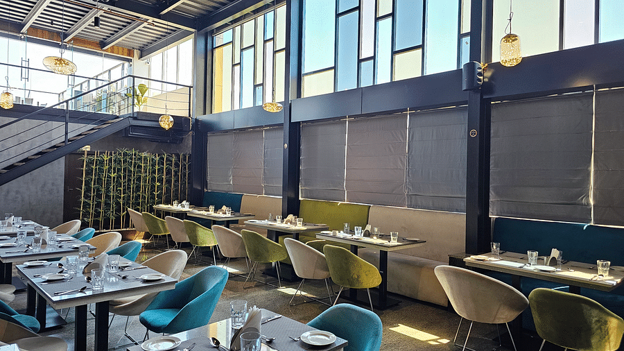 Seating arrangements and view of the windows at Bigg Shots Resto Bar in Quality Inn Rockwell Grand