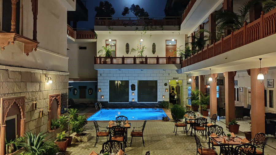 Seating arrangement at Poolside Courtyard Dining at Suryaa Villa Jaipur
