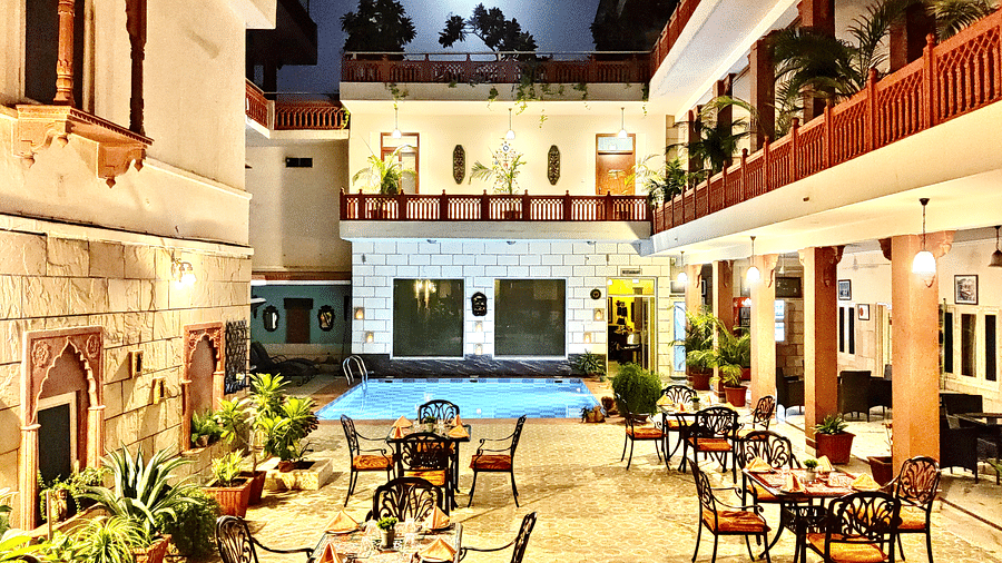 Seating arrangement at Poolside Courtyard Dining at Suryaa Villa Jaipur