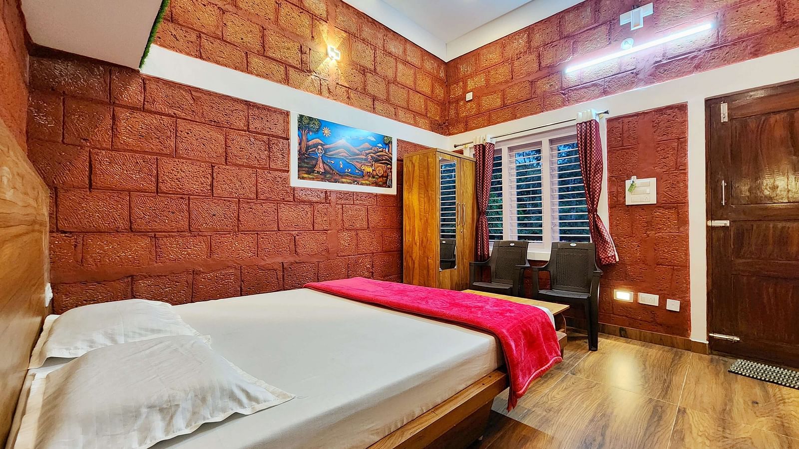 A room with a bed and ambient lighting in Stoneage Retreat - Evergreen County