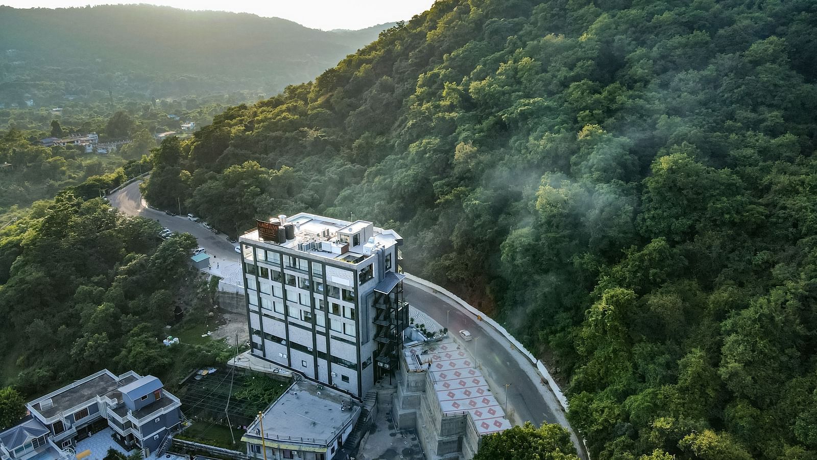 An aerial shot of a misty morning at NAMAMI BY ZENQ BANKHANDI