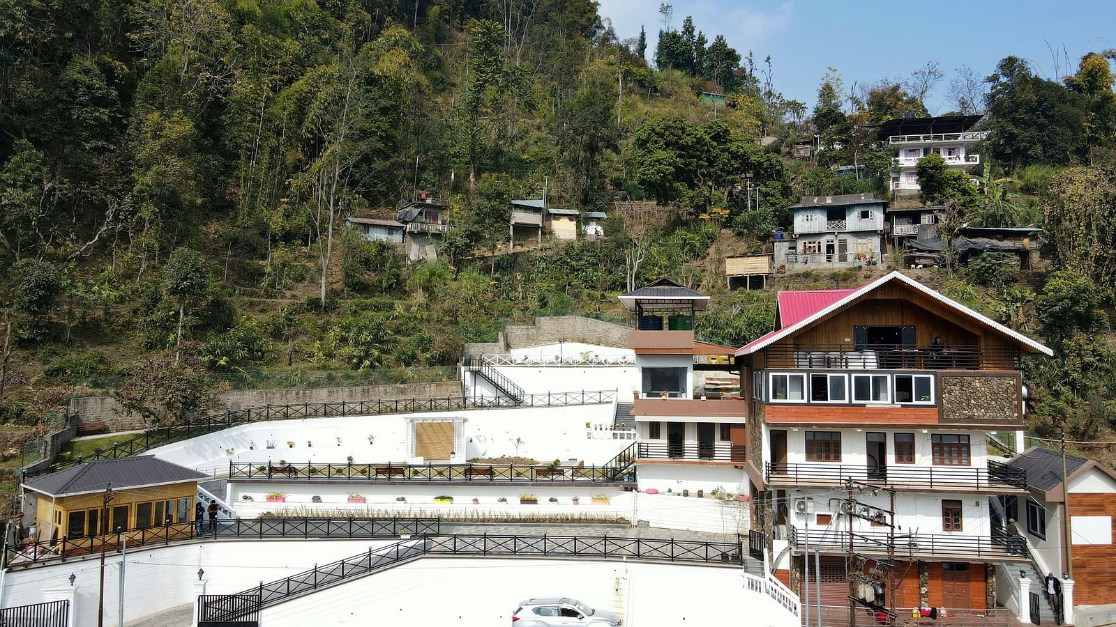 Facade of the hotel with parking space