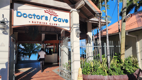 A signage representing the name of Doctors Cave Beach in Jamaica - Hotel 39, Jamaica - Where to Stay in Montego Bay