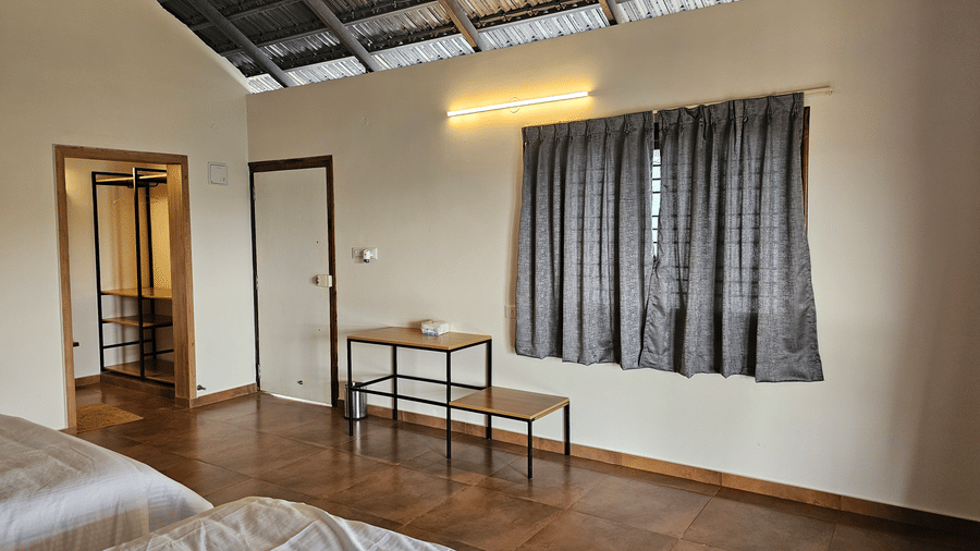 Spacious family room with a seating area, wooden flooring, and contemporary interiors.
