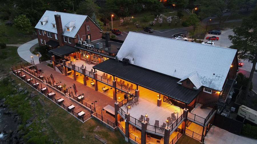 top angle of our resort featuring vast open spaces with white roof taken during the evening - Historic Tapoco Lodge