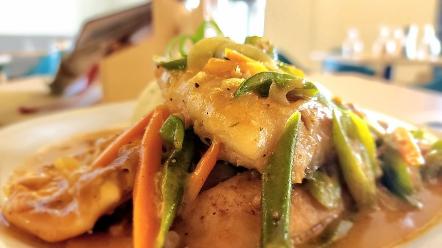 A close-up of a gourmet dish with vibrant vegetables and sauce - Hotel 39, Jamaica