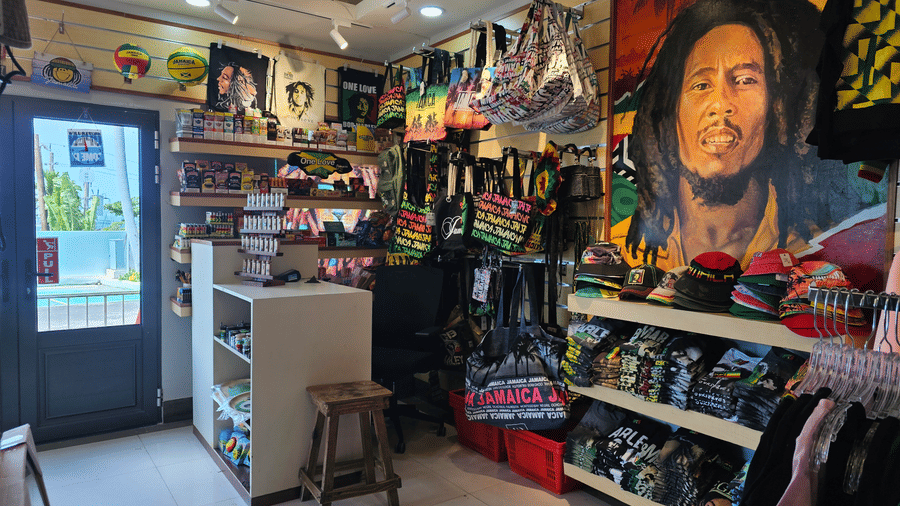 A cozy gift nook inside Hotel 39 Jamaica displaying colorful local souvenirs, handmade crafts, and decorative items, offering guests a charming space to browse and shop unique keepsakes.