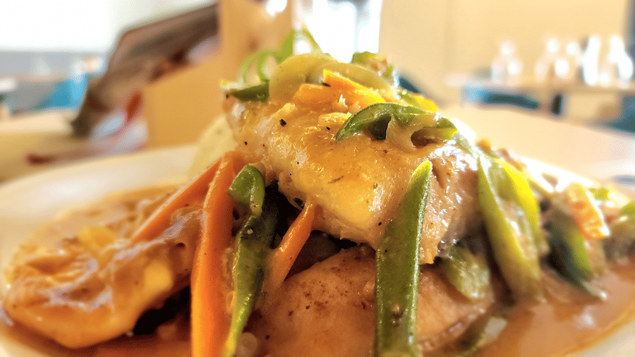 A close-up of a gourmet dish with vibrant vegetables and sauce - Hotel 39, Jamaica