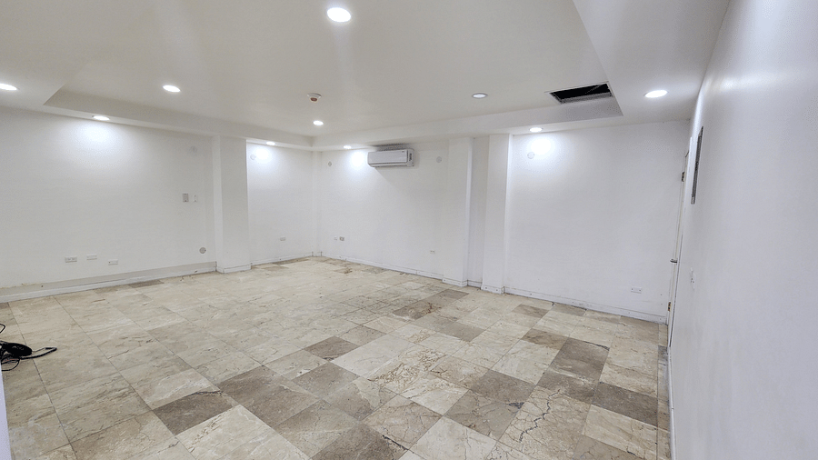 An image of the Situation Room, our event space in Montego Bay with a wall-mounted AC and bright lighting - Hotel 39, Jamaica (Montego Bay)