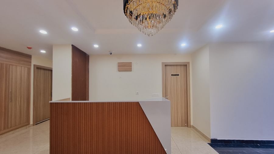 Hotel Reception with table and chandelier at Pines and Peaks, Dalhousie 