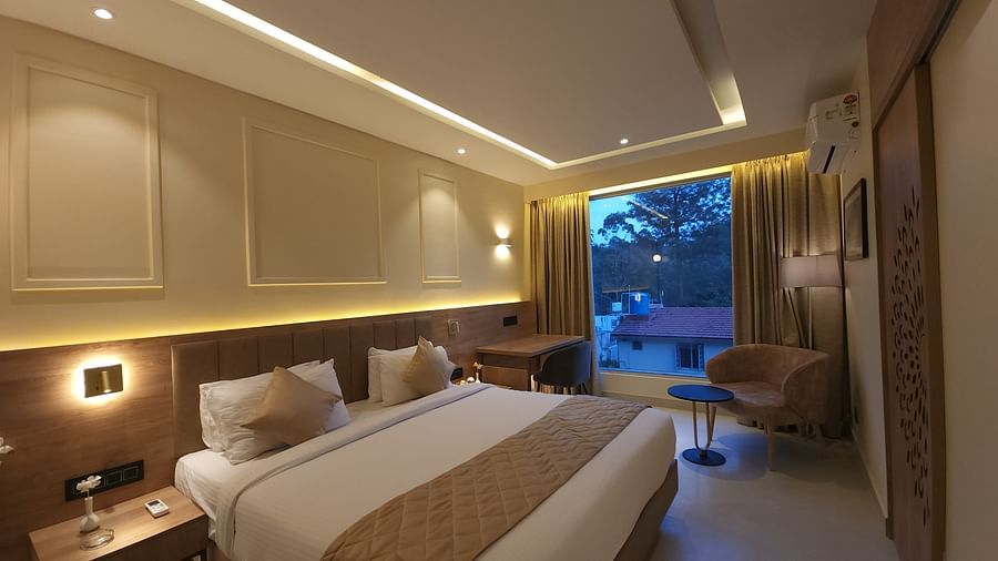 Arabica Presidential Suite with a double bed and side tables