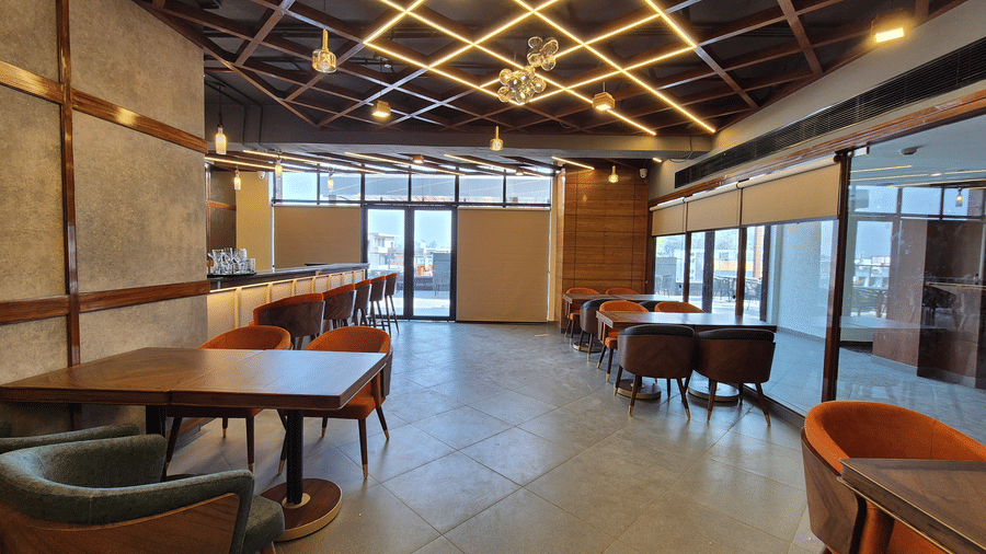 Chic dining area with wooden ceiling design, and cozy seating
