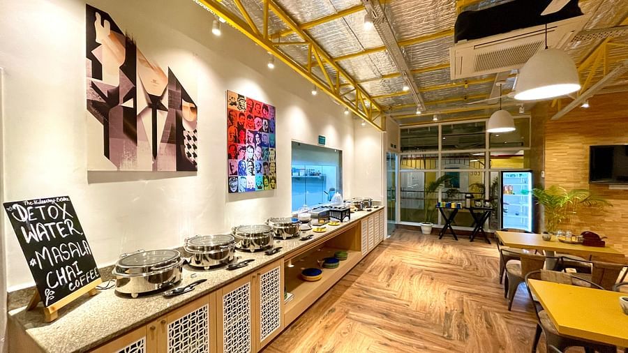 An interior Buffet Counter with seating and wooden flooring