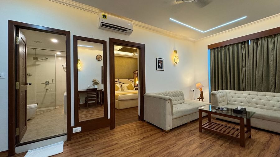Honeymoon suite with a seperate living room and door leading to the bedroom and wahsroom at Vagator Downtown, Goa 