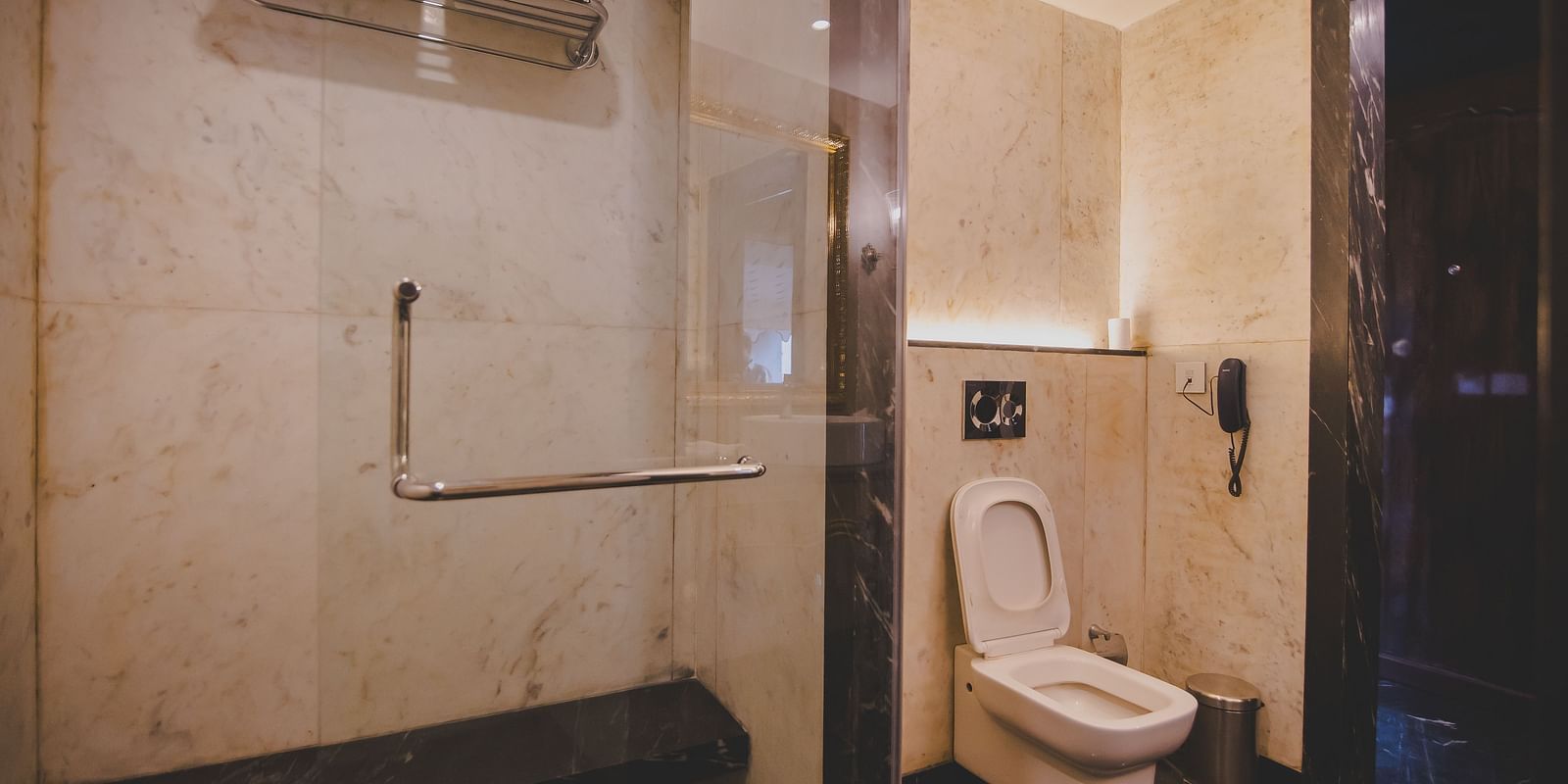 Spacious accessible bathroom at Rajasthali Resort Jaipur with modern fittings and elegant marble finish for a luxury stay.