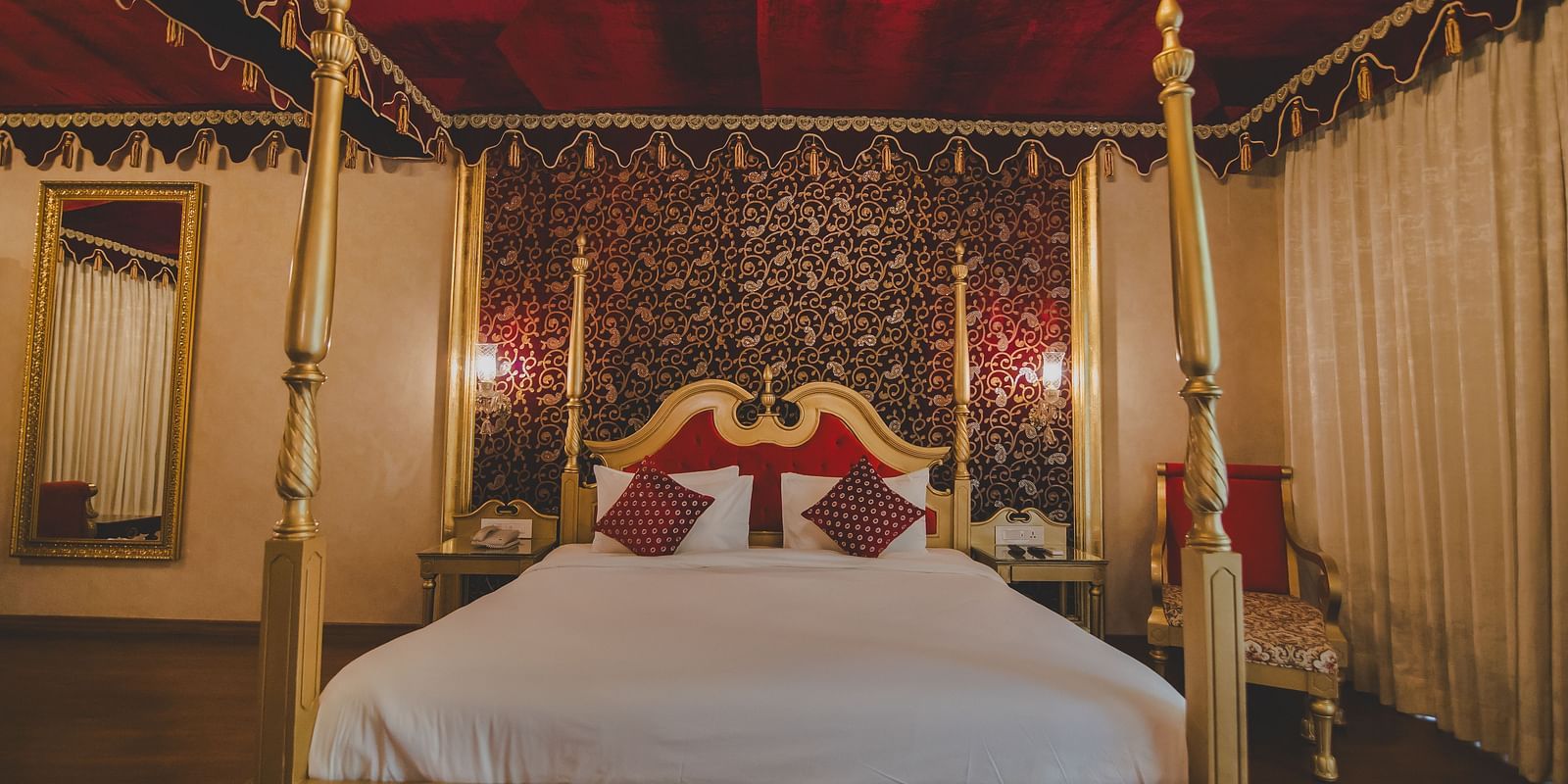 Image of a room with a bed and a mirror on the side at Rajasthali Resort & Spa Jaipur.