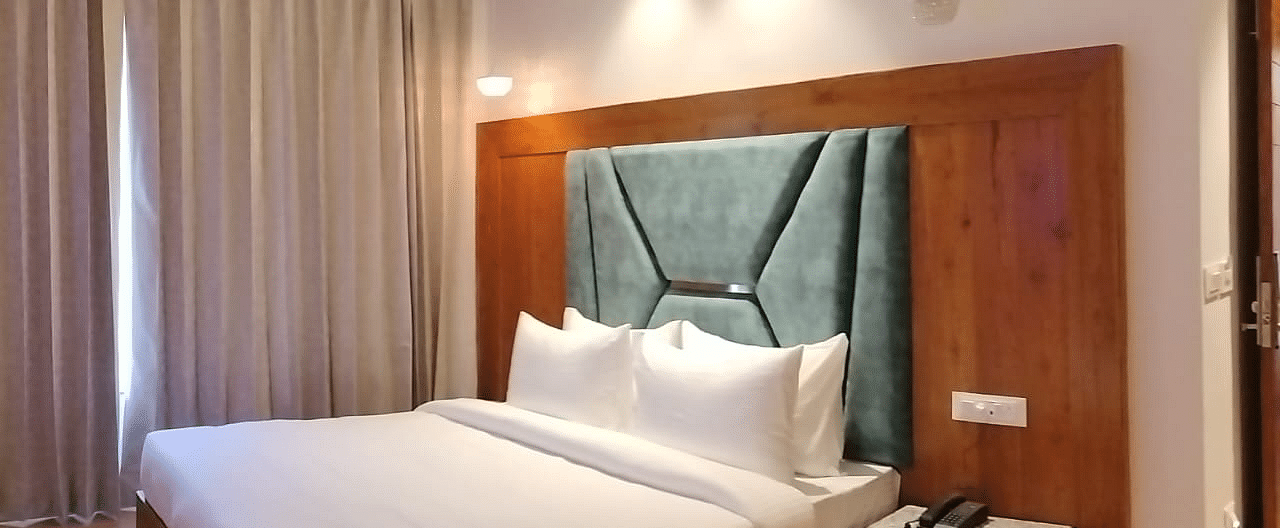 A large bed in Deluxe Non-view Room at DLS Ark Holiday Inn, Banikhet.