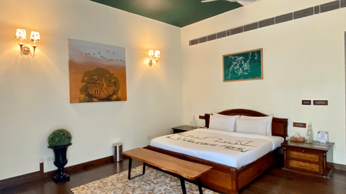 An overview of a bedroom with side tables - Karma Lakelands.