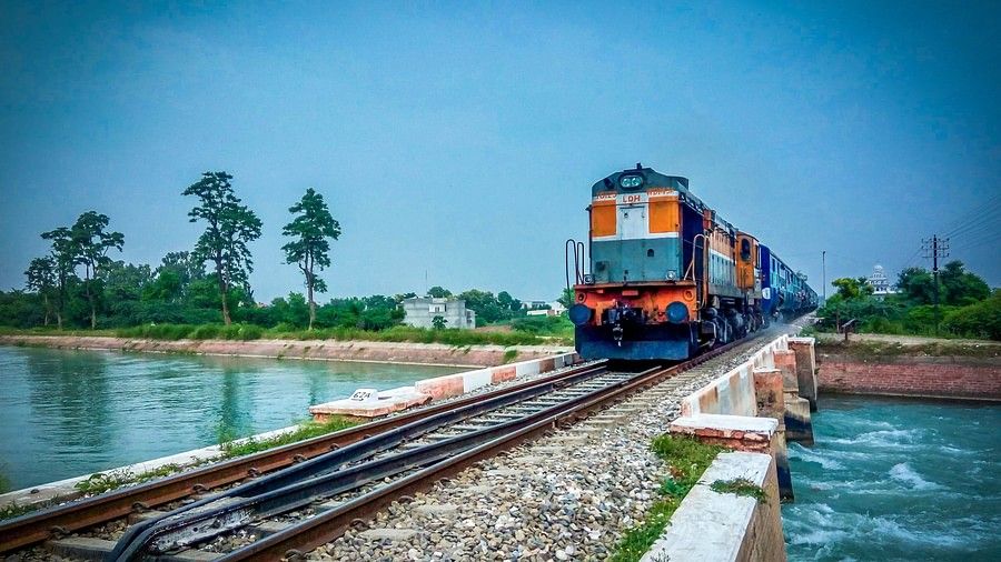 train-by-trees-against-blue-sky-325200