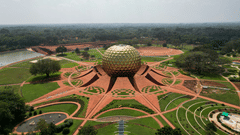 Aerial view of Auroville with the golden dome glowing in the sunlight, one of the places to visit near Pondicherry