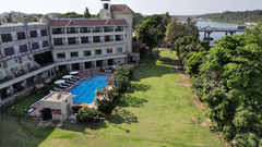 Aerial view of the front lawn of VITS Kamats Resort, Silvassa showcasing the property and the pool