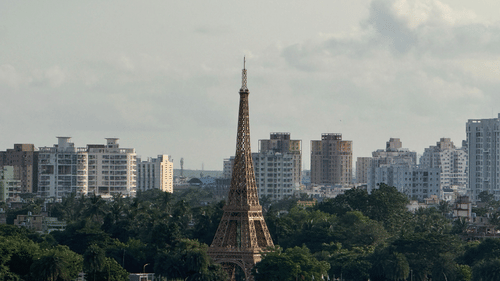 Eiffel Tower replica overlooking a lake within the Eco Park in Kolkata.