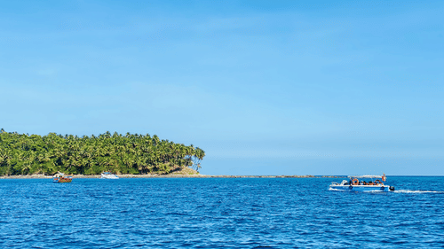 clear blue water and white sand beach at the Andaman Island captured during the day