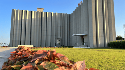 Facade of VITS Jamnagar, Mithoi, with the party plot in Jamnagar featuring a manicured lawn