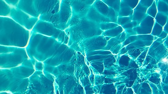 a body of water with light being reflected on the surface