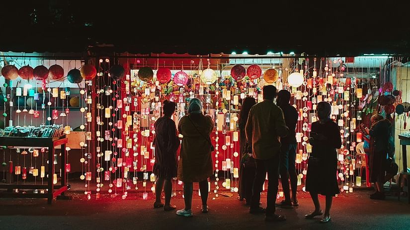 Group of people indulging in street shopping