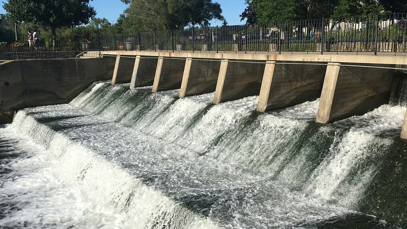 an overview of a dam with water gushing from the pathways