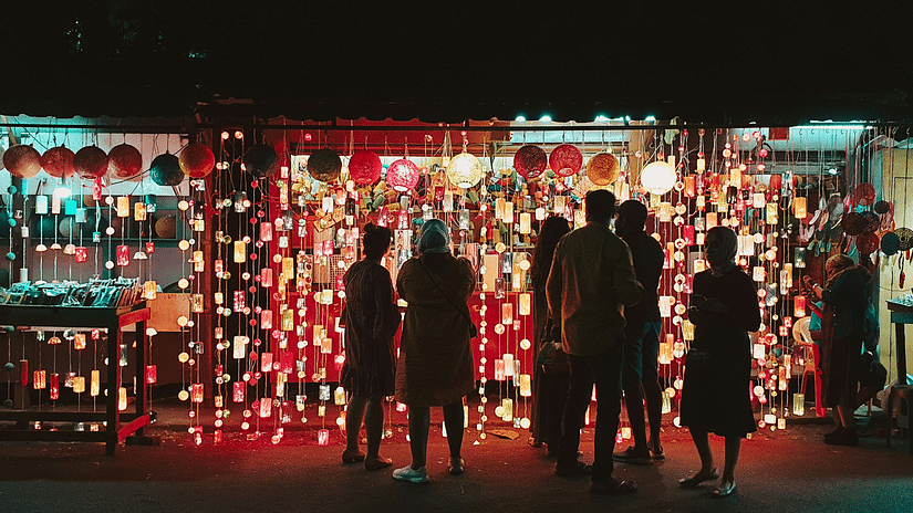 Group of people indulging in street shopping