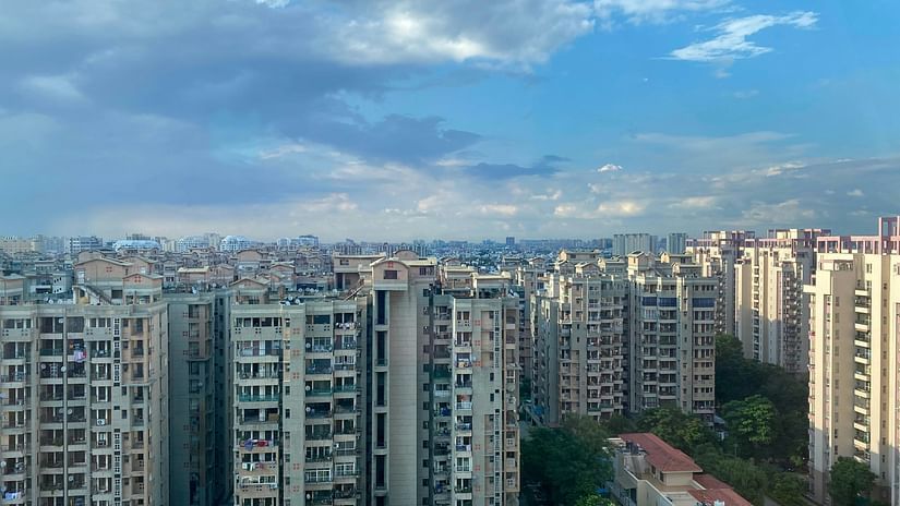 an overview of the high rise buildings in gurgaon with the blue sky in the background