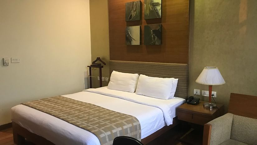 premium queen size bed and white sheets 2