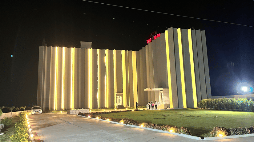 Facade of VITS Jamnagar, Mithoi at night with the lights on.