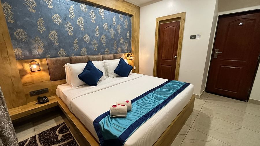 Side view of the Deluxe room with a cosy king-sized bed at Clarks Collection, Somnath