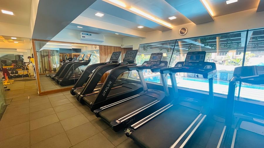 Numerous Treadmills in the gym room at Home2 Renaissance Club Hotel