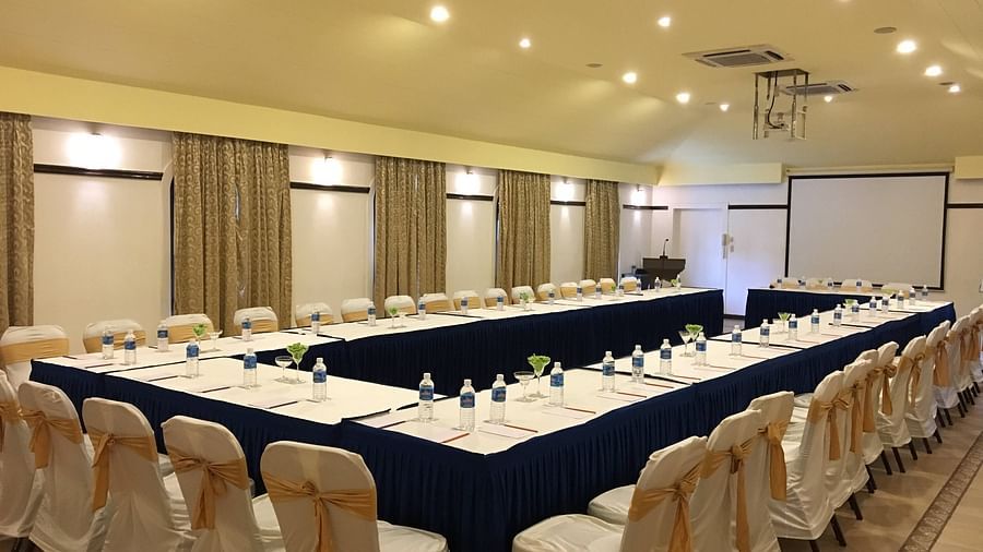Chairs set in a U-shaped seating at Opera Banquet Hall at Kyriad Prestige Calangute, Goa