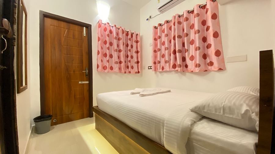Side view of a bed in Family Suite Two Bedroom Apartment 1