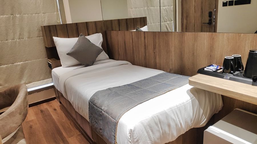 Economy Room with single bed and wooden interiors at Maxxvalue Hotel MIDC,  Mumbai